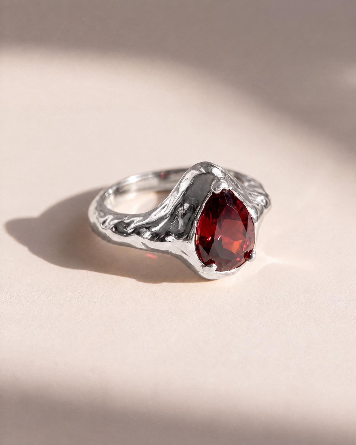 Garnet Tear Ring in 925 sterling silver with a pear cut rhodolite garnet