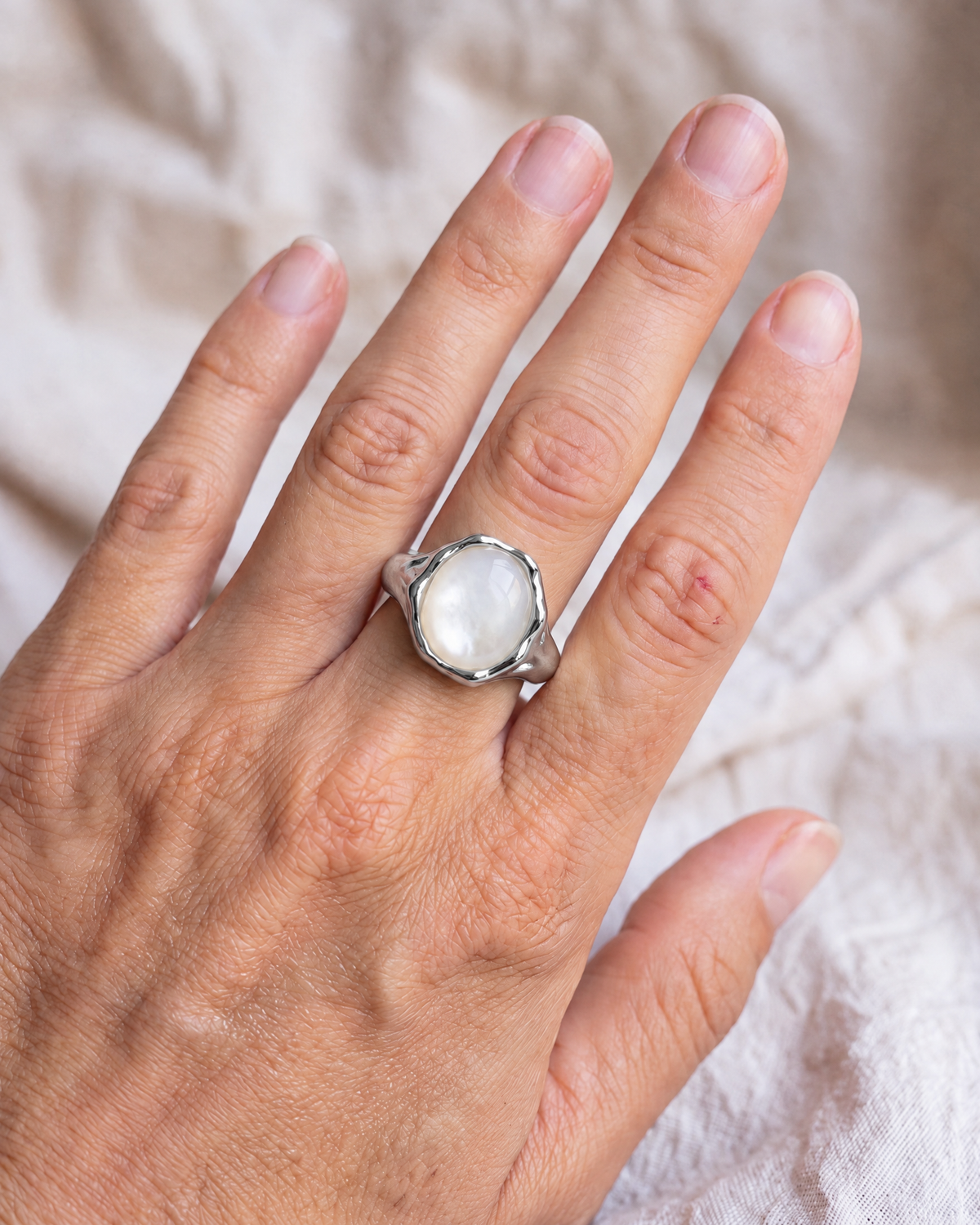 Liquid Pearl Ring in 925 sterling silver worn on the hand, shown true to size