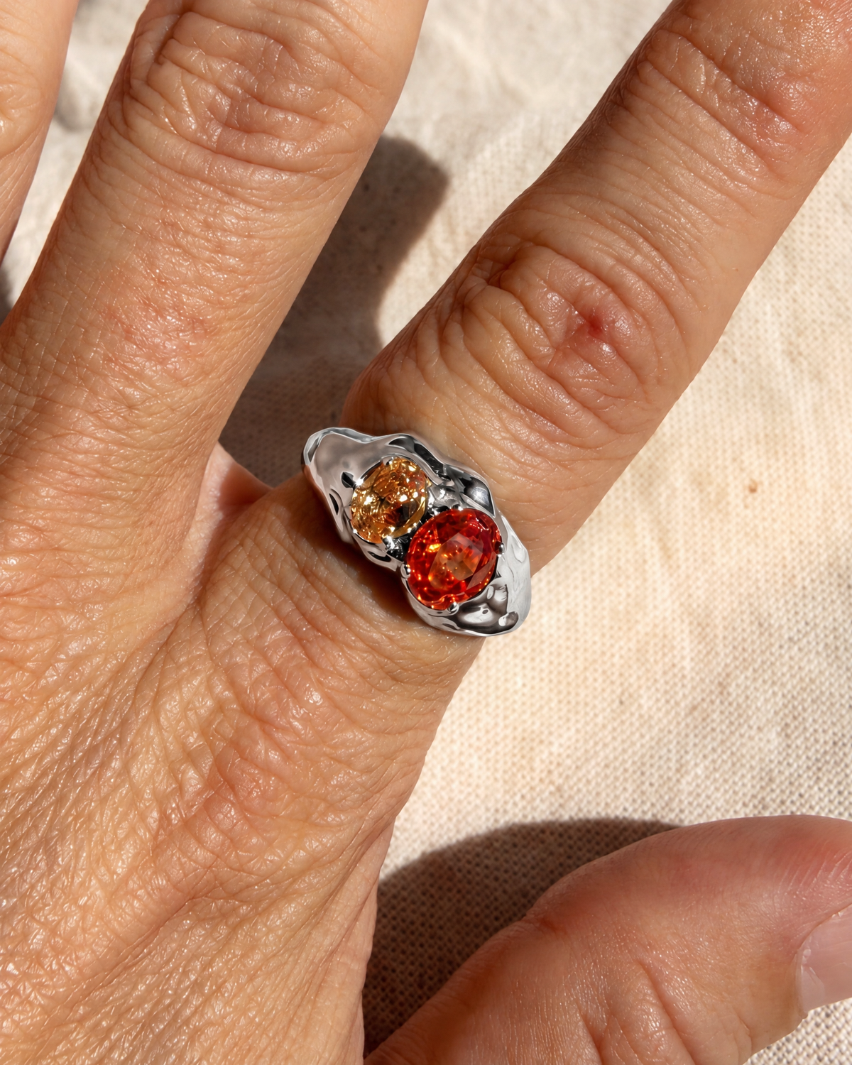 Ember Double Stone Ring in 925 sterling silver worn on the hand, shown true to size