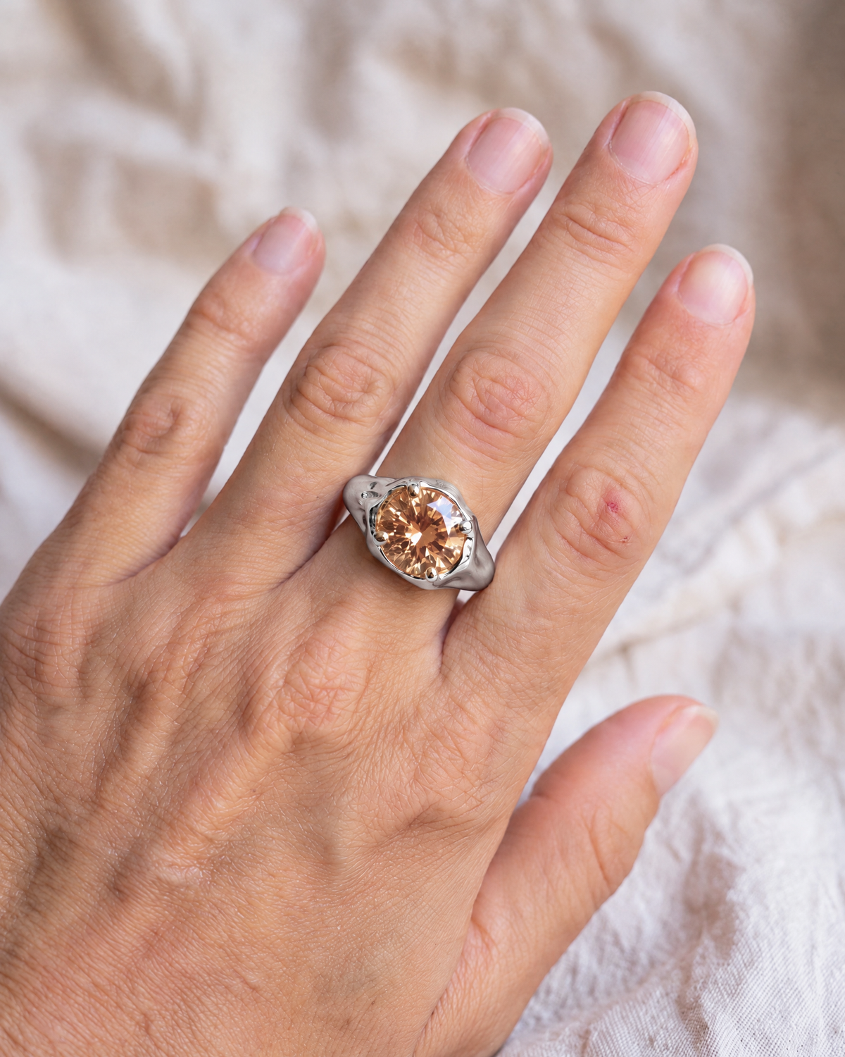 Solar Disc Ring in 925 sterling silver worn on the hand, shown true to size