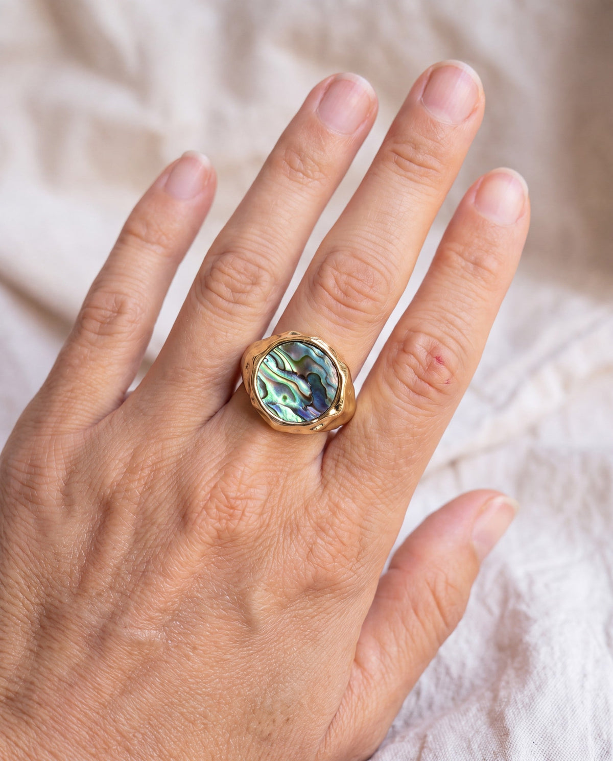 Abalone Dome Ring worn on the hand, shown true to size