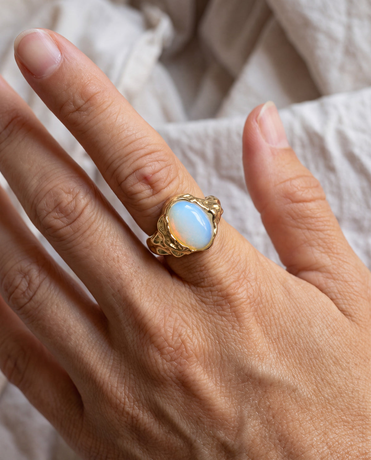 Drift Oval Ring worn on the hand, shown true to size