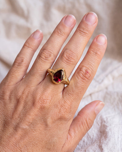 Garnet Tear Ring worn on the hand, shown true to size