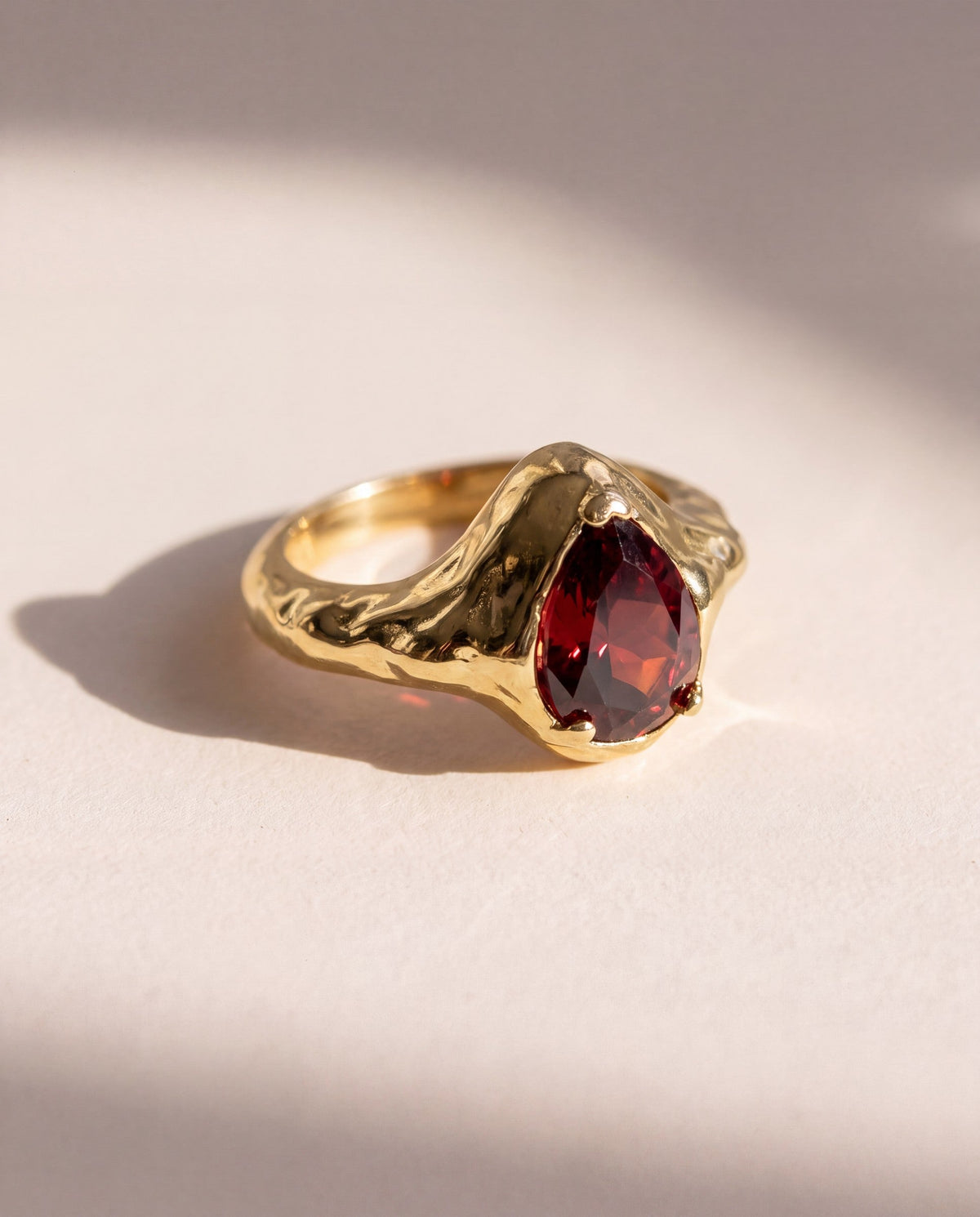 Garnet Tear Ring in 18K gold vermeil with a pear cut rhodolite garnet