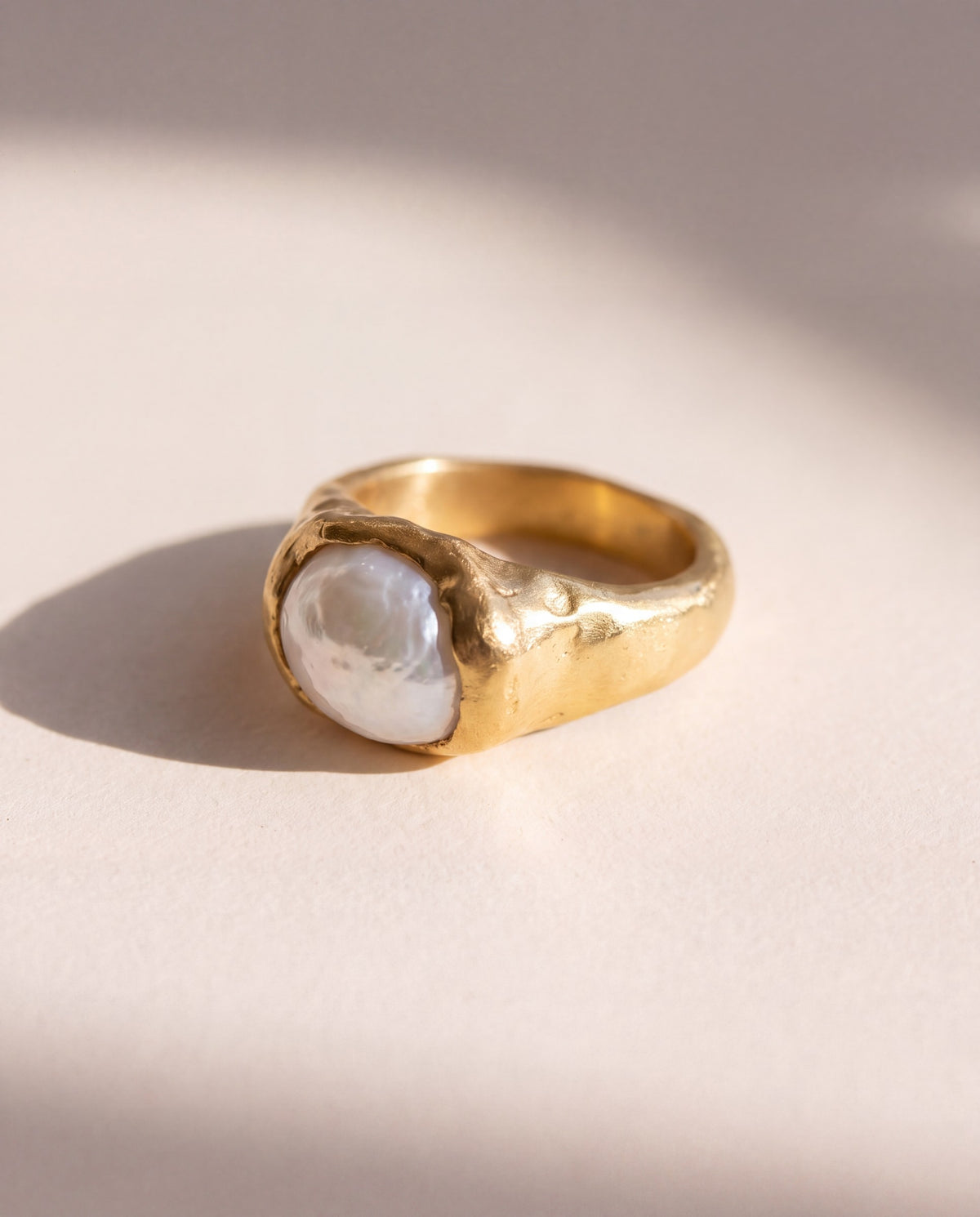 Raw Pearl Molten Ring in matte 18K gold vermeil, a baroque pearl held in a raw hand formed bezel