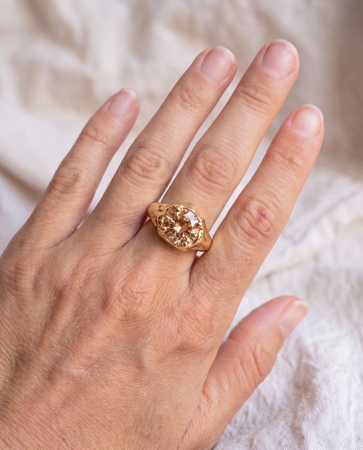 Solar Disc Ring worn on the hand, shown true to size